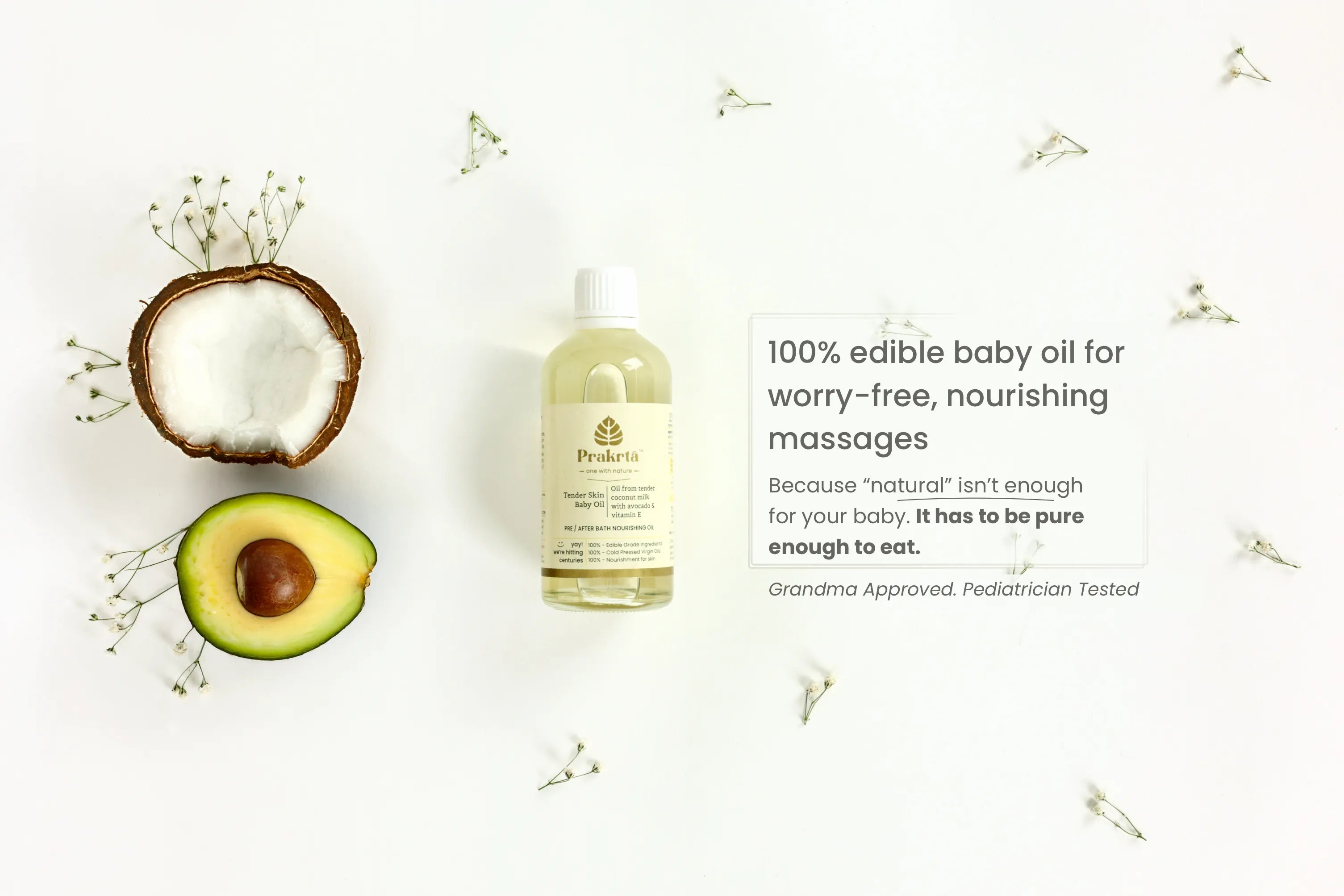 Bottle of baby oil with avocado and coconut on a light background